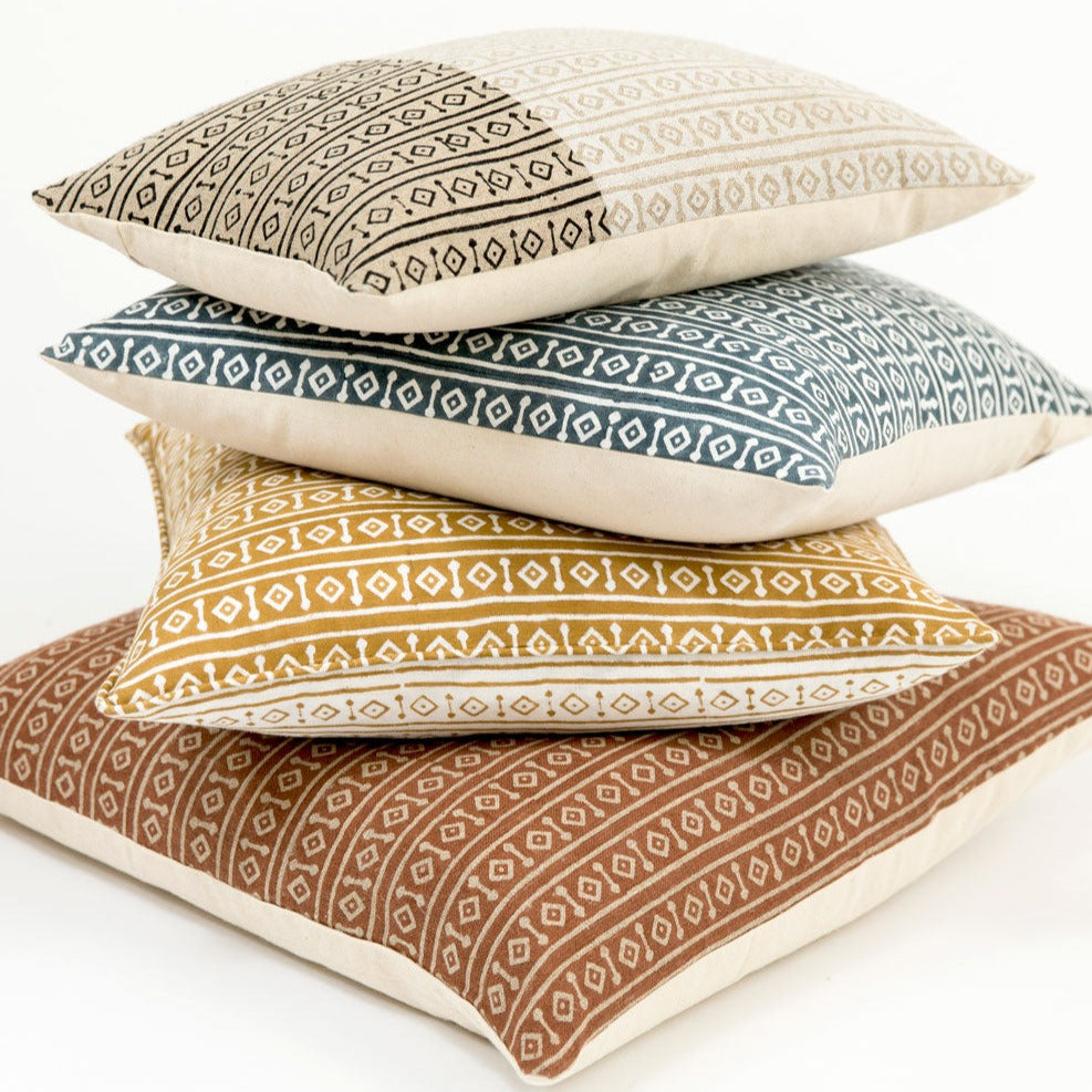 brightly colored geometric pillows